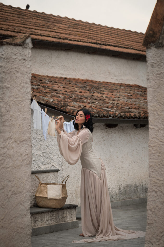 Outdoor scene in front of white Italian villa, moody fashion photography