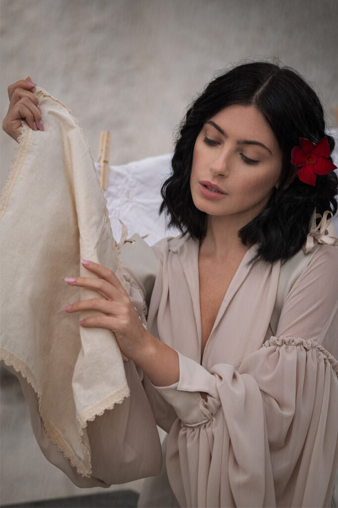 Outdoor scene in front of white Italian villa, moody fashion photography